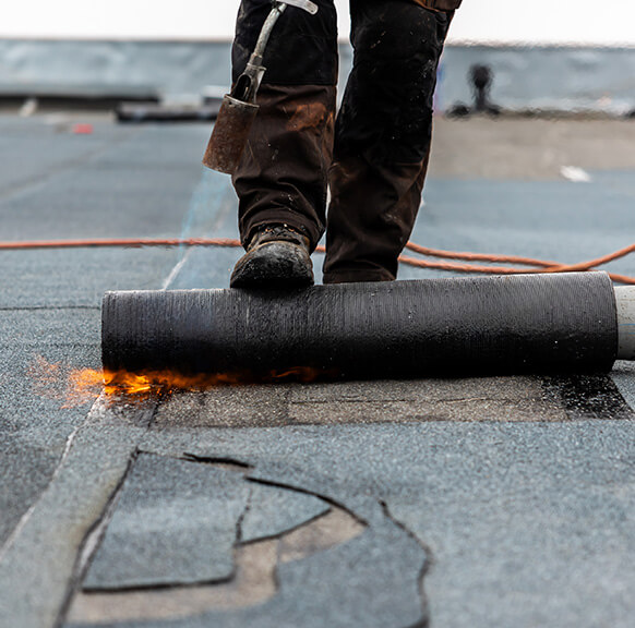 roofers from our roofing company completing commercial roof repair in colorado