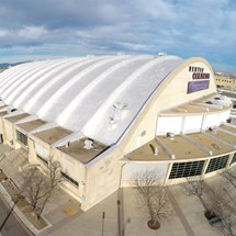 large domed building installed with sheet metal from our roofers in colorado