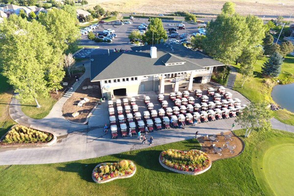 structure with a slanted roof adjacent to a golf course