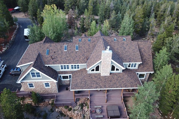 residential roofing on a home surrounded by nature