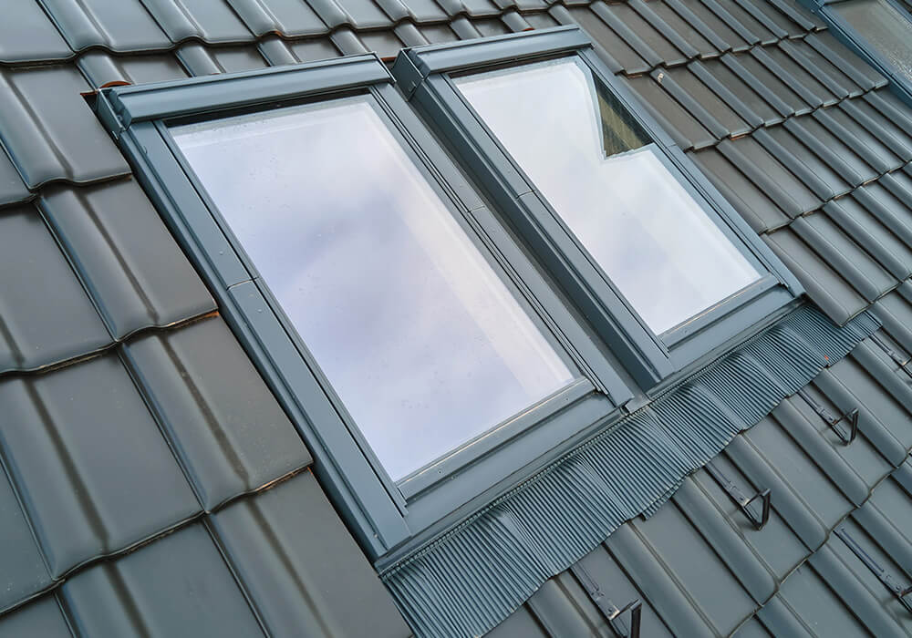 skylights installed by our roofers on the side of a roof