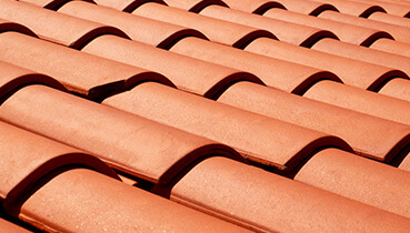 Designer asphalt shingles allow for unique looks and greater durability and color options